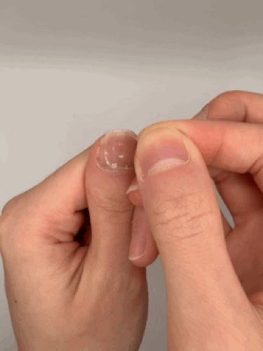 Place tab on nail and press firmly