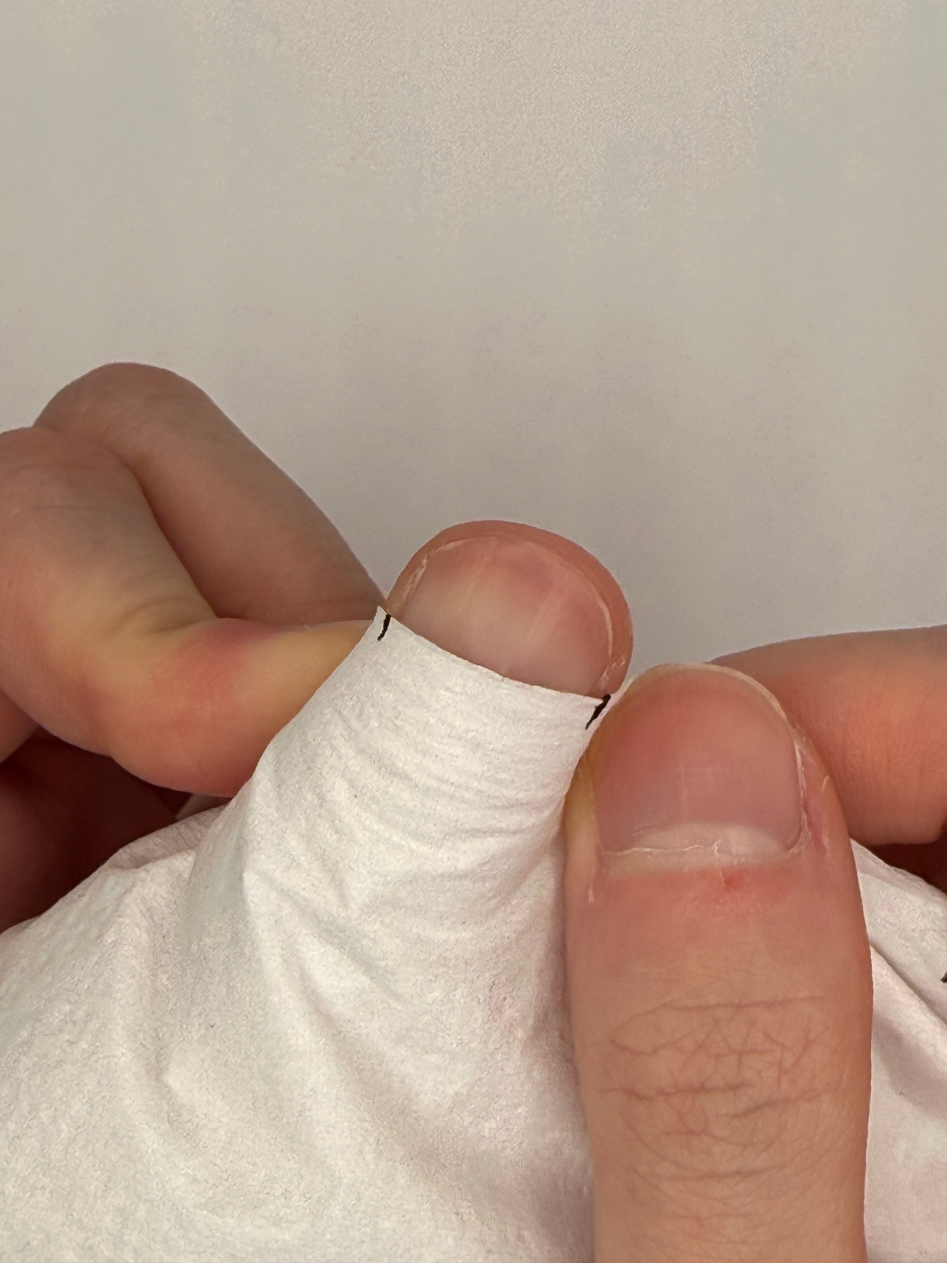 Measuring a nail with paper, step 2