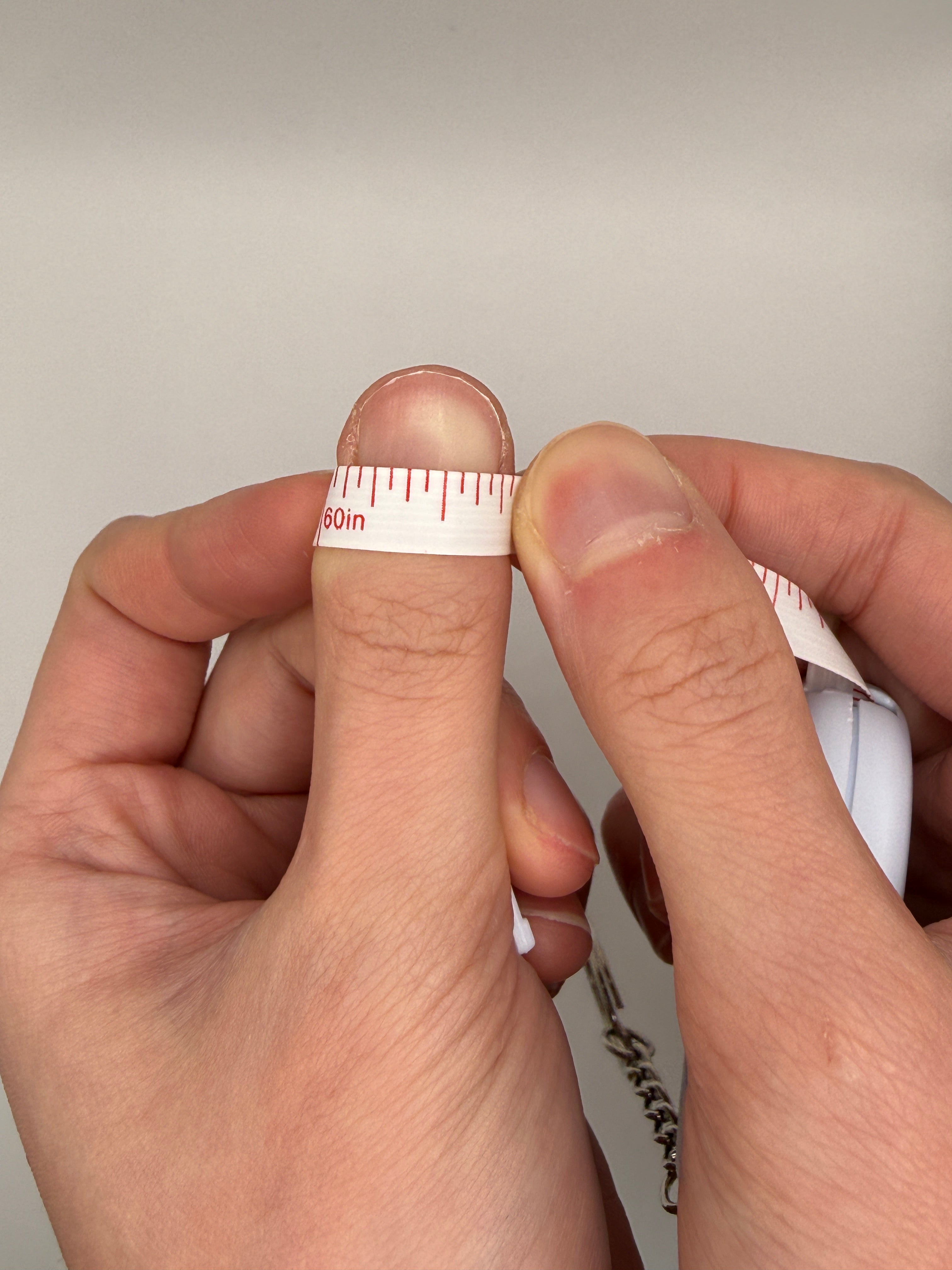 Measuring a nail with tape, step 2