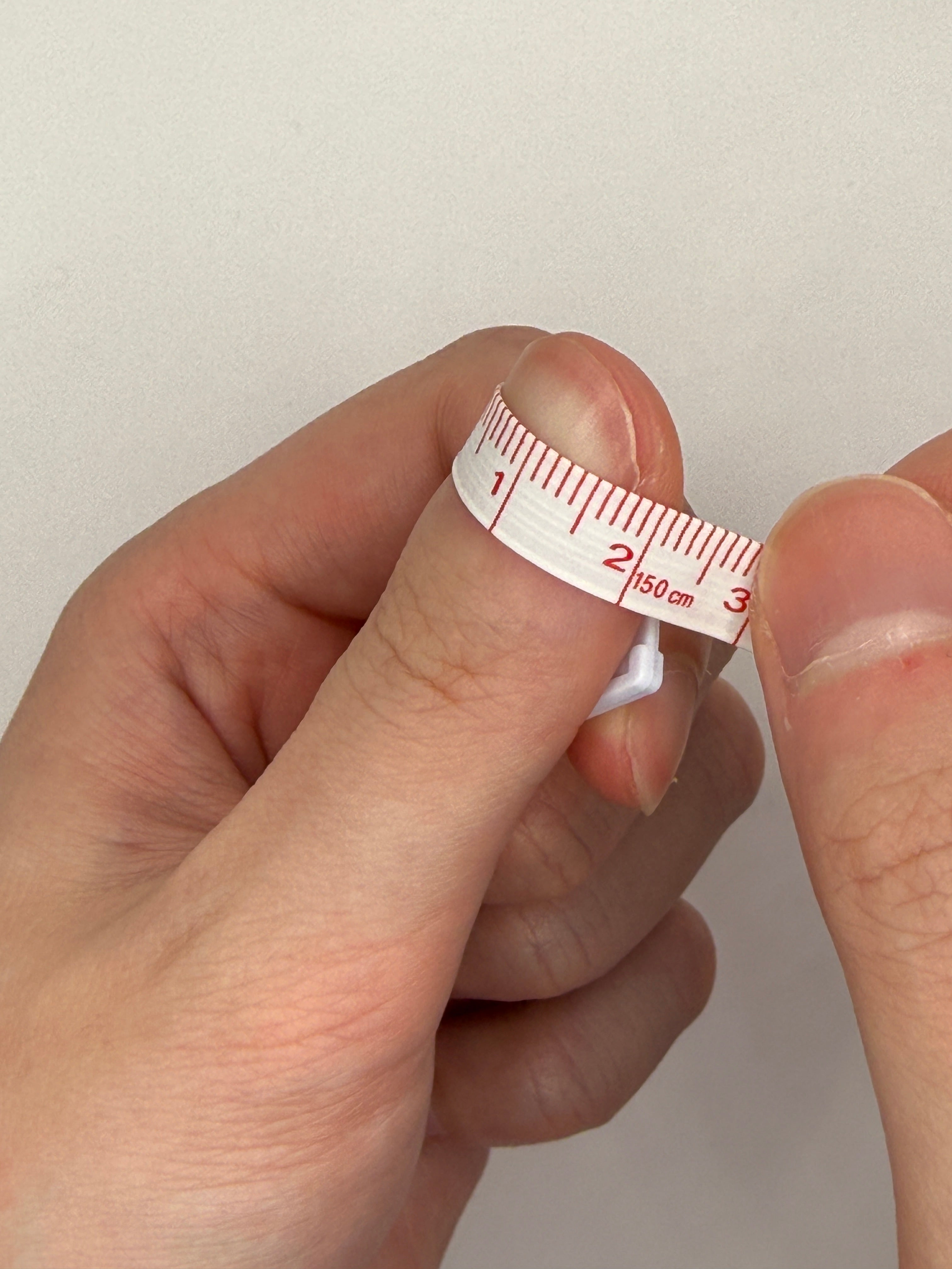 Measuring a nail with tape, step 3